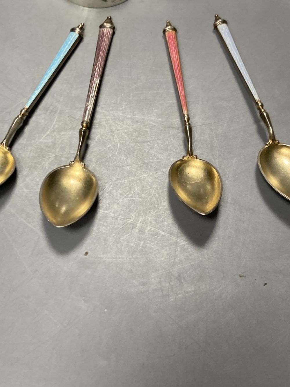 A pair of late Victorian silver pepperettes, London, 1891, 95mm, A George III silver caddy spoon, etc.